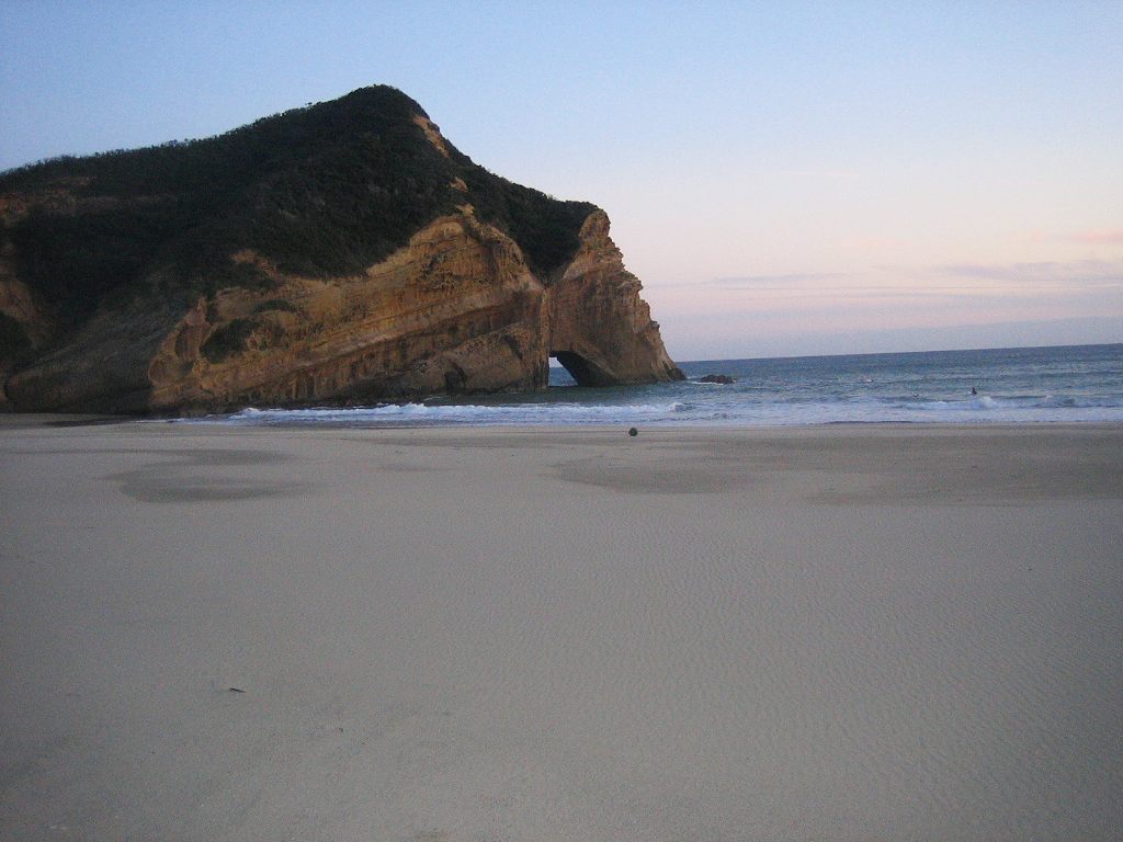 Surfing and space in Tanegashima island, Kagoshima, Japan. The rock called "Elephant Rock" is at the surfing point "In front of Tanegashima Iwasaki Hotel".