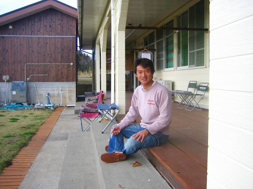 Surfing and space in Tanegashima island, Kagoshima, Japan. He is Mr. Morohashi who is owner of the guest house YuYu.