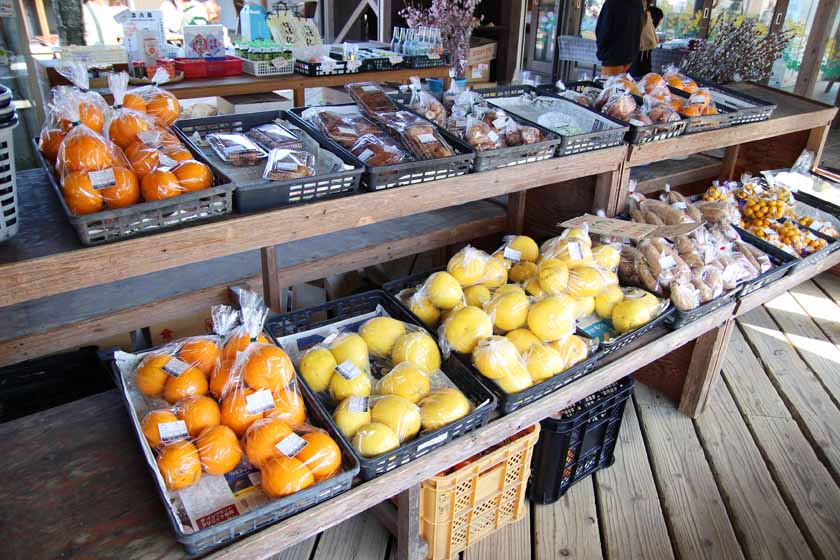 Fruits and vegetables are sold at a store in the Nokonoichi market.